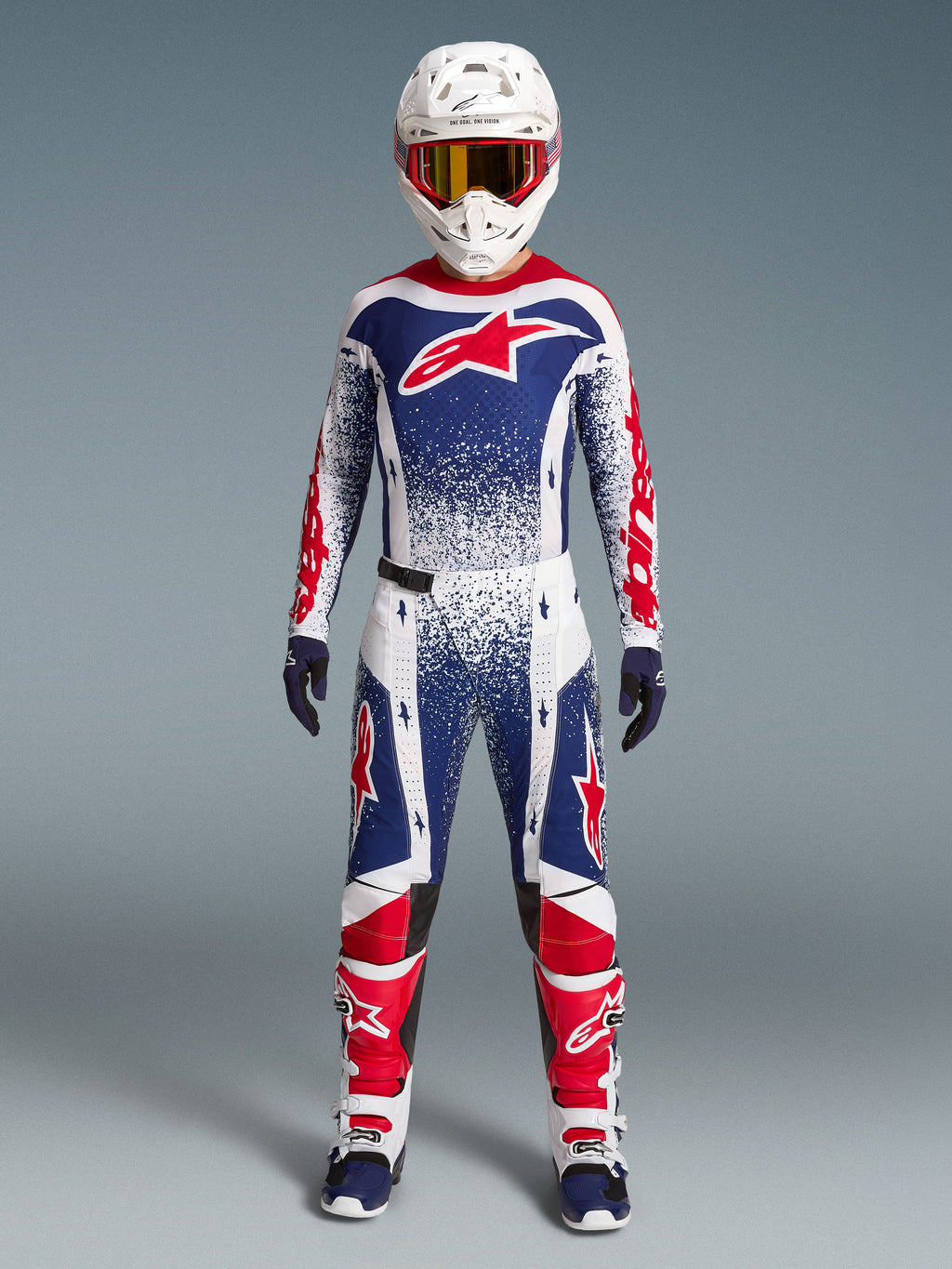 Alpinestars Techstar Unity Jersey, maillot de motocross rouge, blanc et bleu, graphismes mouchetés, édition limitée.