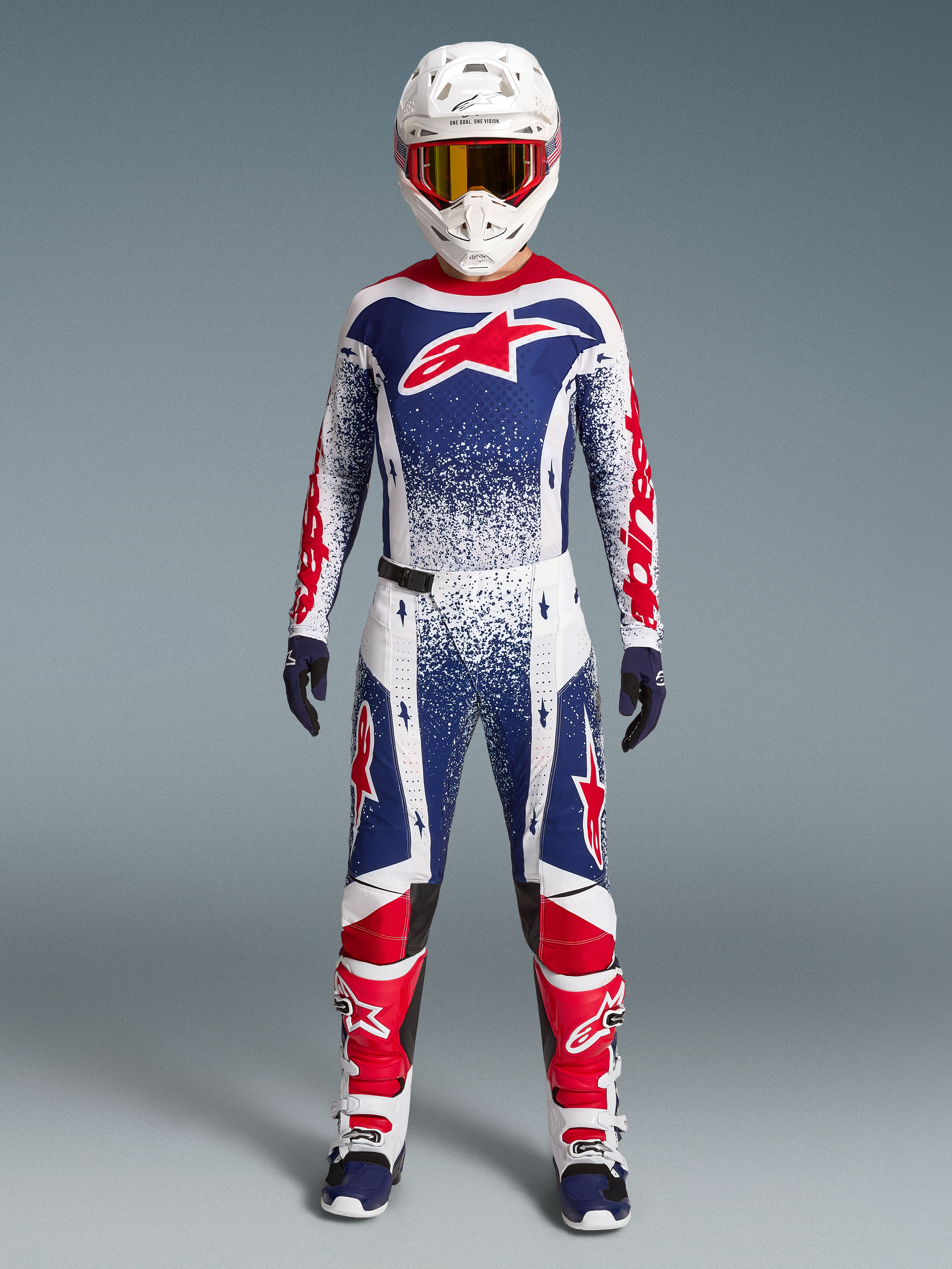 Alpinestars Techstar Unity Jersey, maillot de motocross rouge, blanc et bleu, graphismes mouchetés, édition limitée.