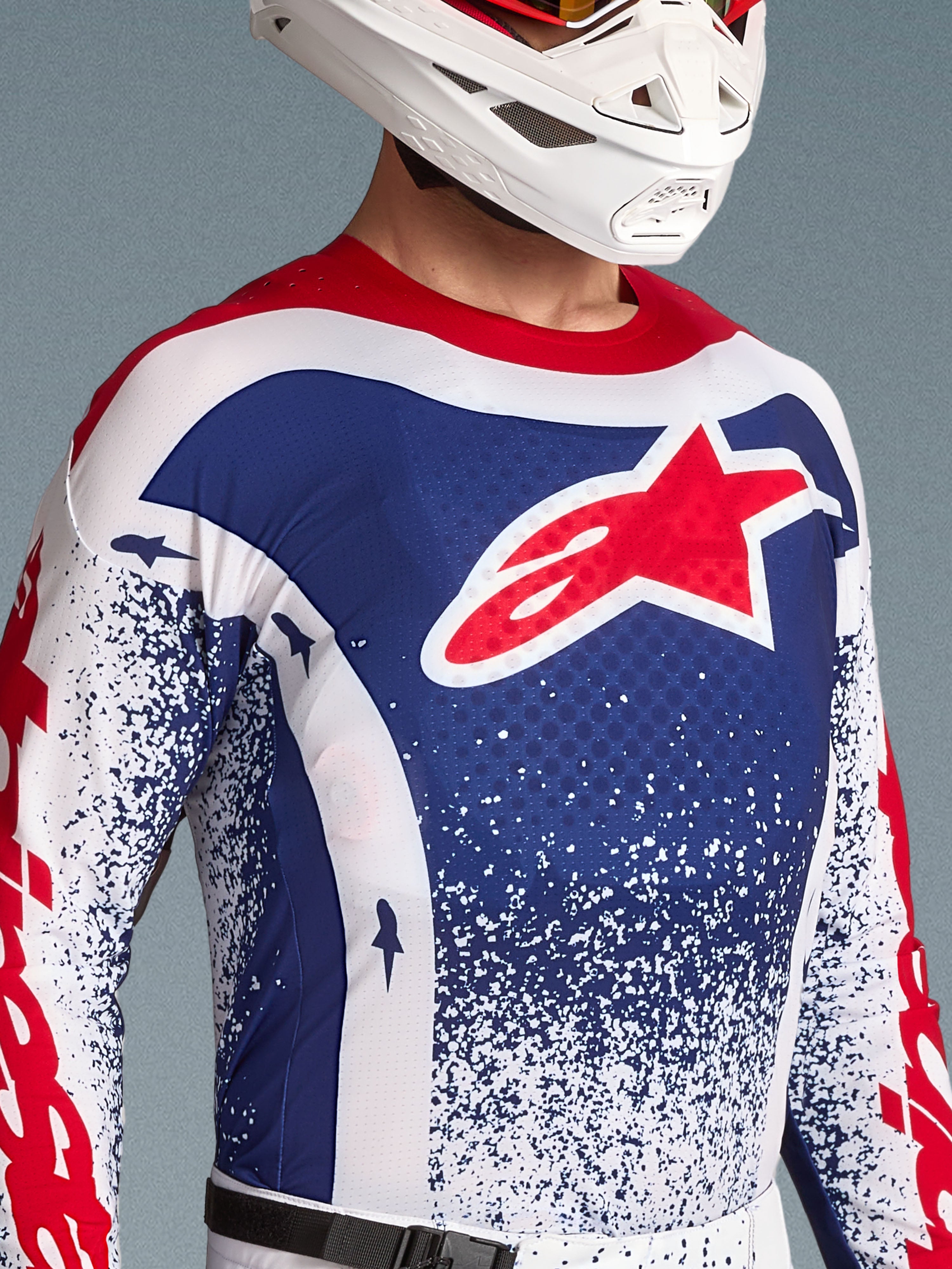 Alpinestars Limited Edition Techstar Unity jersey voor heren, blauw-wit motorcross-shirt met rood sterlogo.