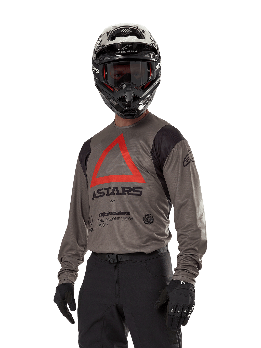 Alpinestars Techdura Jersey, Motocross Off-road Jersey, Falcon Brown with Red Triangle and black branding, worn with black pants, black and white helmet, and black gloves