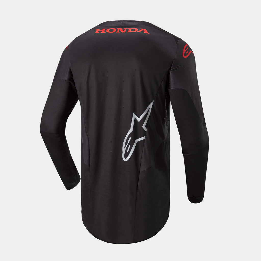 Alpinestars Honda Racer Iconic jersey, heren motorcross jersey met lange mouwen, zwart met rode en witte brandingdetails, achteraanzicht met Honda-logo en Alpinestars-graphics, verlengde achterzoom