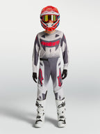 Alpinestars 2027 Youth Supertech Swan Jersey and Gear Set, gray and white motocross racing outfit with red accents.