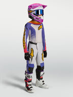 Alpinestars jeugd Fluid Drag gearset en jersey, motorcrossuitrusting, blauw en wit met roze en gouden accenten.