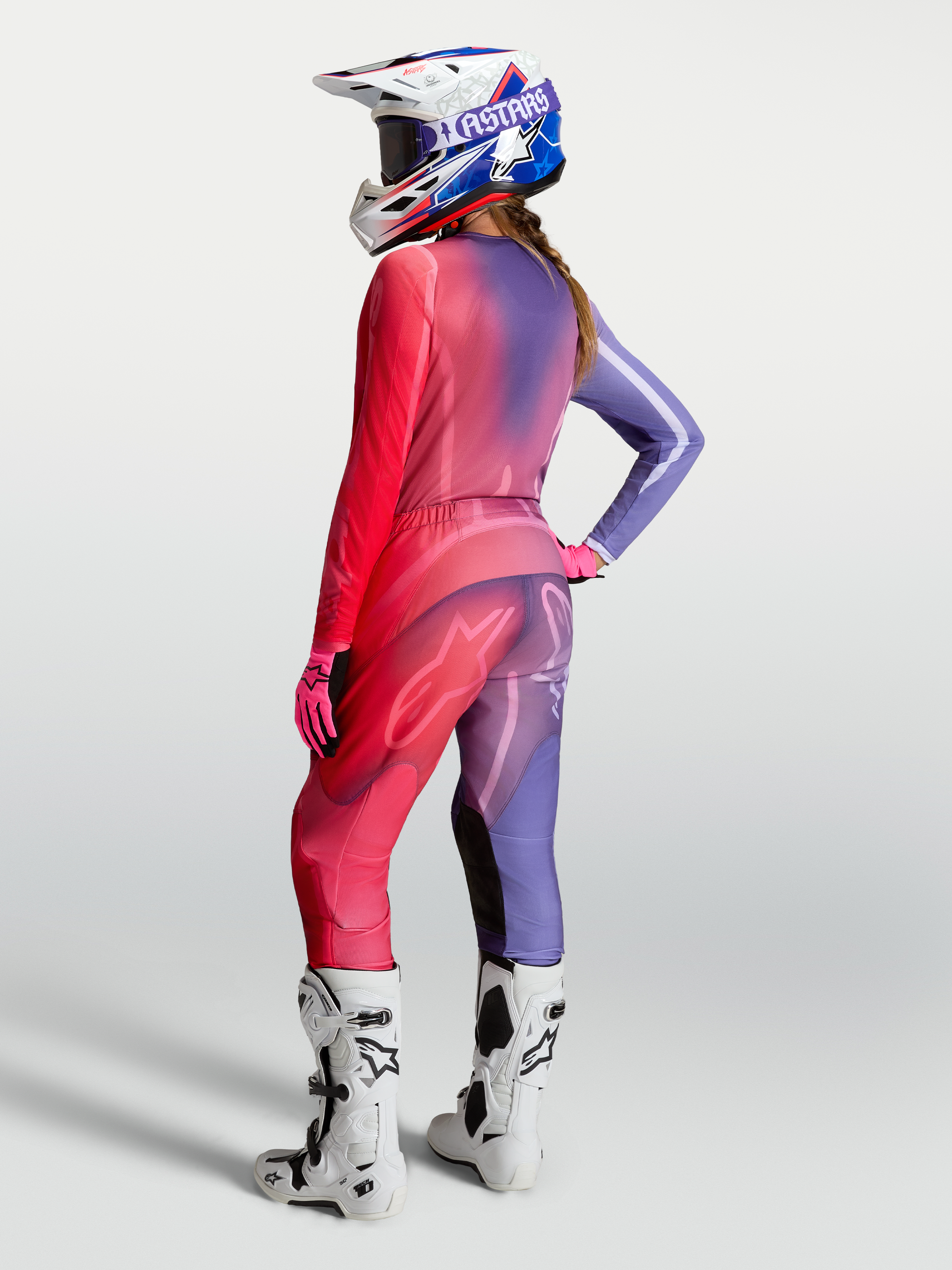 Alpinestars Stella Fluid Kepler Pants and Gear Set, purple and rouge red women's motocross racing outfit on-model.