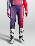 Alpinestars Stella Fluid Kepler, pantalon de motocross pour femme, violet et rouge, avec genoux renforcés.