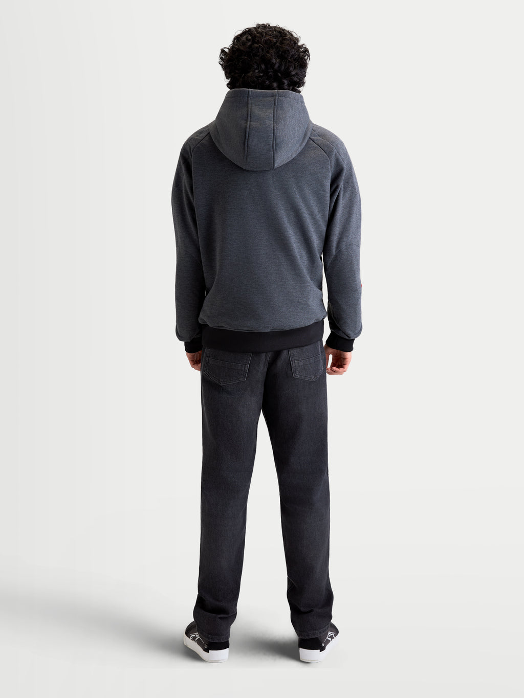 Alpinestars Ageless Hoodie, men's urban motorcycle hoodie jacket in asphalt melange gray, rear view showing a model wearing the textile riding hoodie with a fixed hood and reinforced back construction