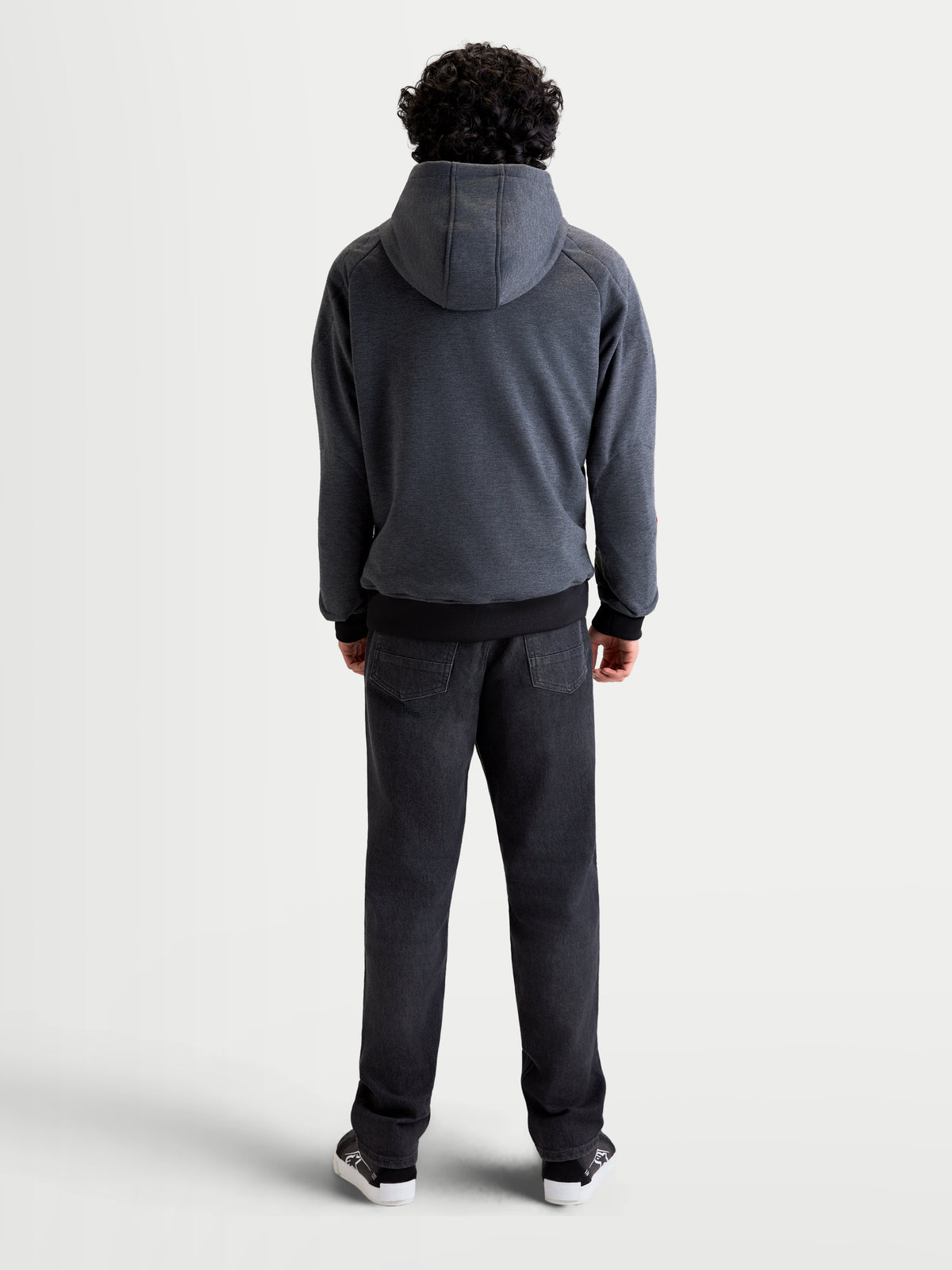 Alpinestars Ageless Hoodie, men's urban motorcycle hoodie jacket in asphalt melange gray, rear view showing a model wearing the textile riding hoodie with a fixed hood and reinforced back construction