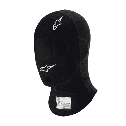 Alpinestars Race V3 Balaclava, cagoule de course automobile noire ignifugée, logos étoiles blanches sur le front et la joue, étiquette d'homologation FIA sur le cou, tissu technique léger avec ouverture pour les yeux pour la protection de la tête en sport automobile