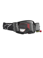 Alpinestars Supertech Firma Roll Off veiligheidsbril, motorcrossbril in zwart en zilver met helder roll-off systeem voor off-road competitie.