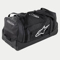 Alpinestars Komodo Reisetasche, große Motocross-Ausrüstungstasche in Schwarz und Anthrazit mit weißen Logos, ausgestattet mit Rollen und einem Teleskopgriff, strapazierfähige Konstruktion für den Transport von Rennausrüstung