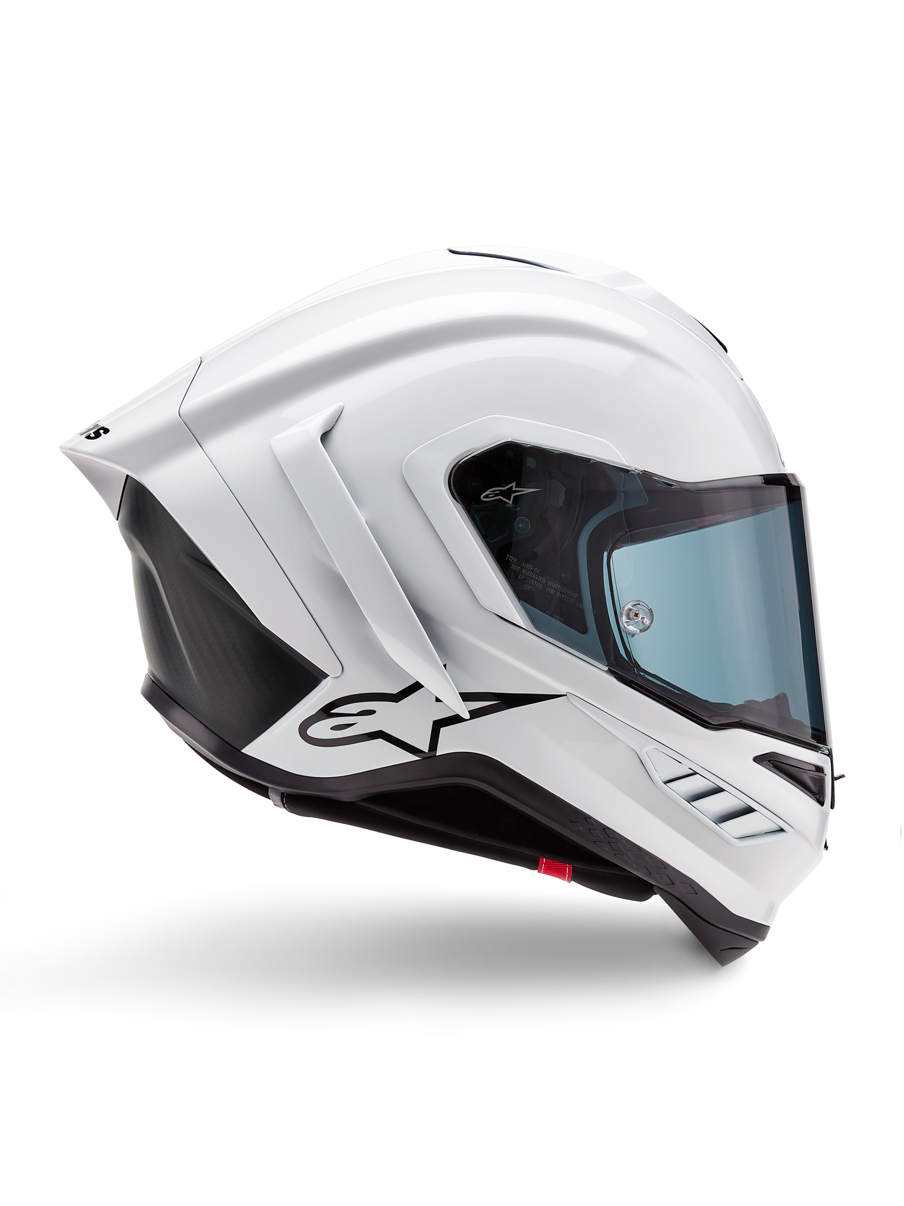 Casque Alpinestars Supertech R10 Solid, casque de moto racing blanc brillant et noir mat, vue de profil, design aérodynamique avec ailerons arrière et évents latéraux, visière teintée bleu, arborant un logo étoile Alpinestars noir sur le côté