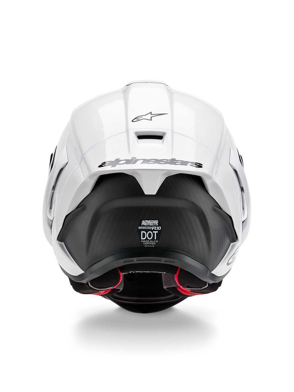 Casque Alpinestars Supertech R10 Solid, vue arrière, partie supérieure blanc brillant avec section inférieure noir mat, spoiler aérodynamique avec logo Alpinestars noir, texture en fibre de carbone visible et autocollants de certification de sécurité