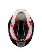 Alpinestars Supertech R10 Team-helm, bovenaanzicht, zwart carbon met rode en witte glanzende accenten, aerodynamische schaal met centrale ventilatieopeningen en opvallende race-graphics, professionele sportmotorhelm.