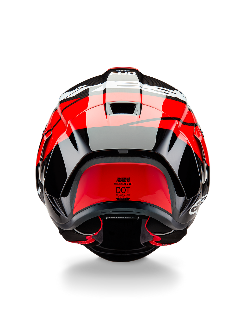 Casque Alpinestars Supertech R10 Element, vue arrière, carbone noir avec des accents rouge vif et blanc brillant, doté d'un aileron arrière aérodynamique, d'extracteurs d'air et de l'étiquette de certification DOT, design épuré inspiré de la course avec détails en fibre de carbone