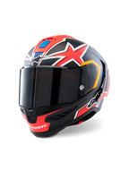Casque Alpinestars Supertech R10 Miller Limited Edition, casque de course intégral, Carbone Rouge Mat avec étoiles rouges, accents bleus et jaunes, visière fumée foncée, coque en carbone aérodynamique pour la compétition moto professionnelle
