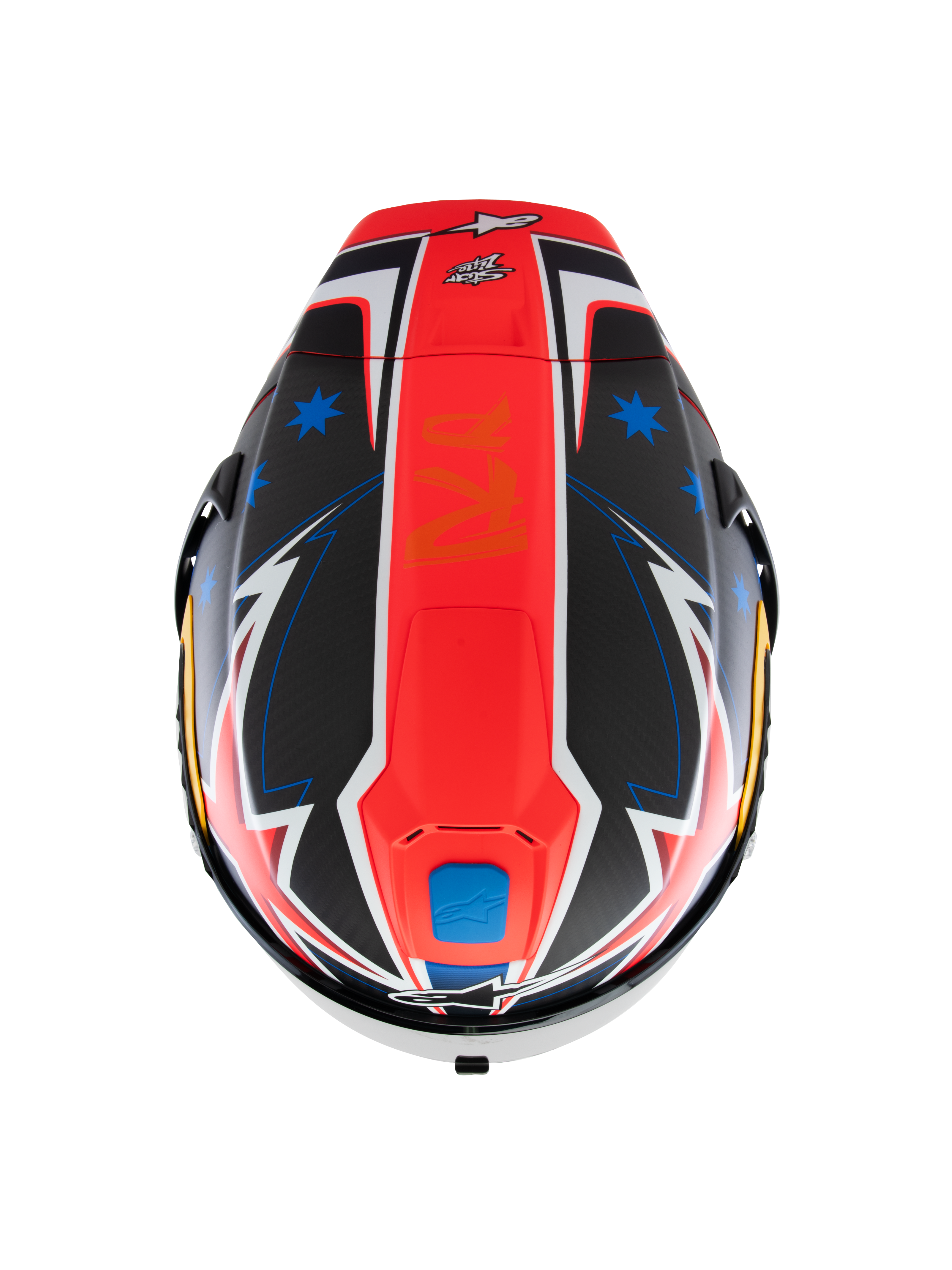 Casque Alpinestars Supertech R10 Miller Limited Edition, vue de dessus, graphique Carbon Red Matt avec bande rouge centrale, étoiles bleues sur sections en fibre de carbone noire, détails blancs et bleus style éclair, design aérodynamique pour la performance sur piste.