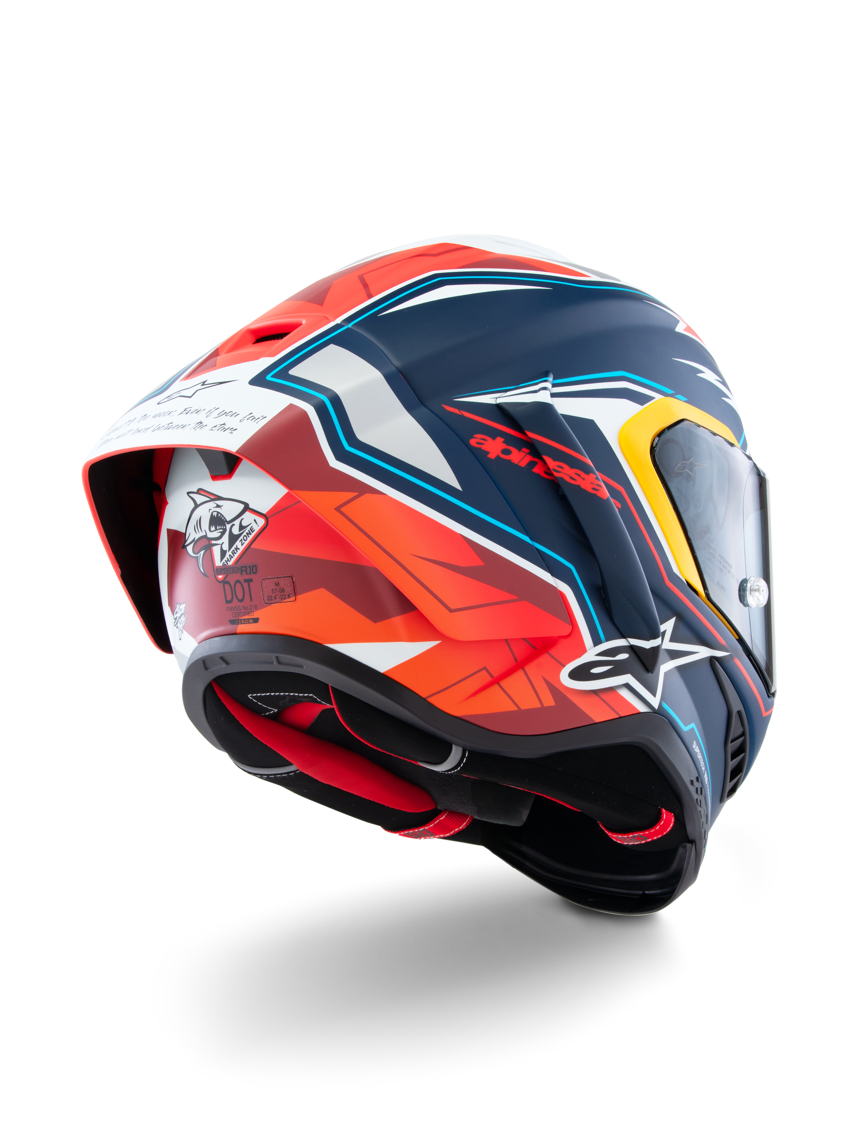Casque Alpinestars Supertech R10 Acosta Edition Limitée, vue de trois-quarts arrière, finition mate bleue, rouge et blanche, avec spoiler aérodynamique, graphique de requin à l'arrière, logos Alpinestars et certification DOT, casque de moto de course haute performance