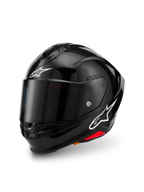Alpinestars S-R7 Solid Helm, Schwarz glänzend, Integral-Motorradhelm mit Kohlefaser-Verbundschale, weiße Stern-Logos auf Stirn und Seite, aerodynamisches Design mit integriertem Spoiler und Belüftungsöffnungen