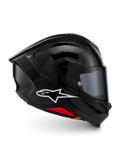 Alpinestars S-R7 Solid Helm, Integral-Motorradhelm, Schwarz glänzend, Profilansicht mit weißem A-Star-Logo, stromlinienförmige aerodynamische Außenschale mit integriertem Spoiler und roten Akzenten an der Unterseite, entwickelt für Rennsport- und Sport-Performance.