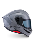 Alpinestars S-R7 Solid Helm, Integral-Motorradhelm, Grau glänzend, Seitenprofilansicht, glänzend graue aerodynamische Schale mit schwarzem Logo und roten Akzenten an der Basis, Hochleistungs-Rennsport- und Sport-Fahrausrüstung