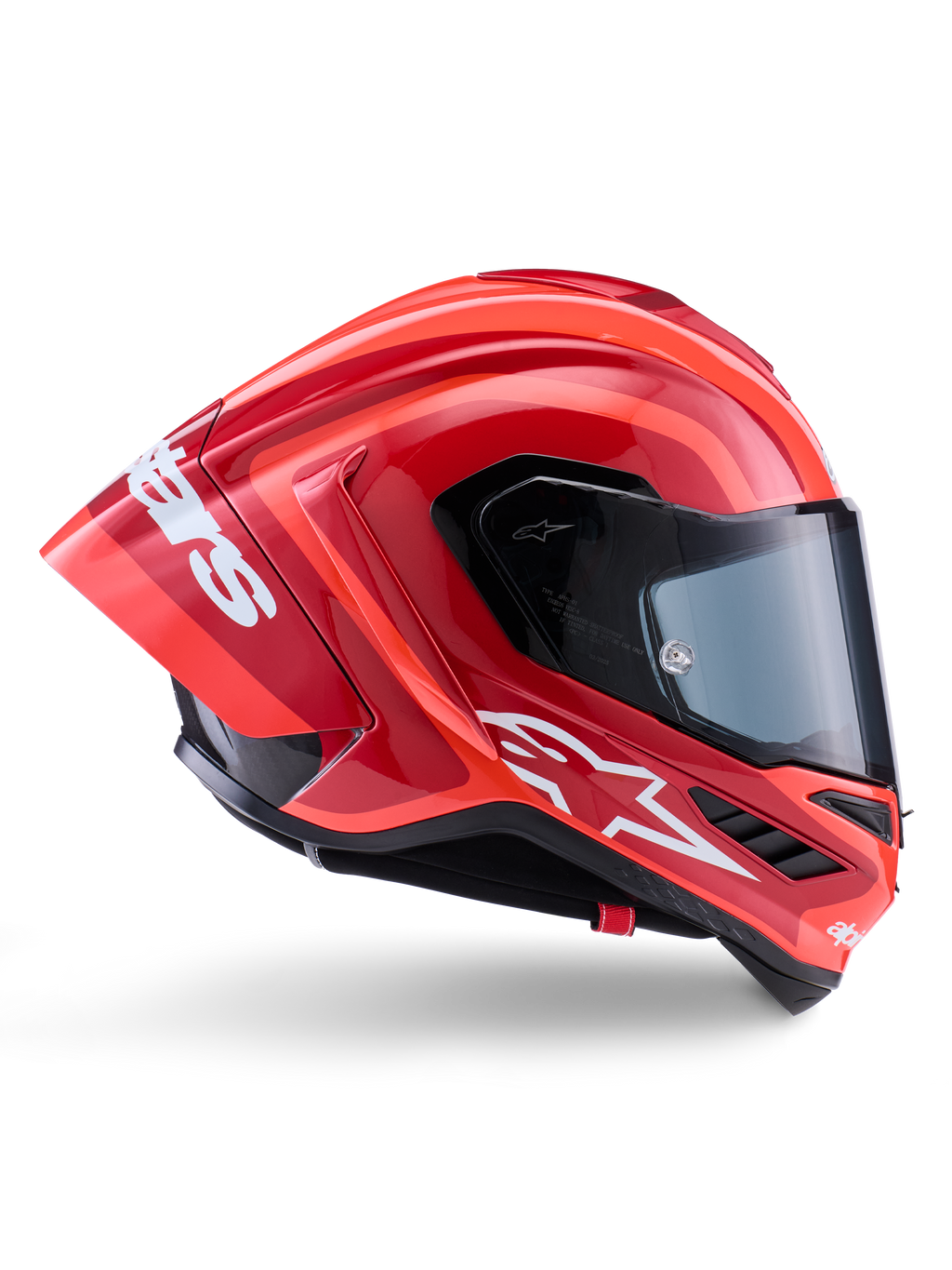 Casque Alpinestars Supertech R10 Arius, casque de course intégral, rouge et orange brillant, vue de profil présentant un spoiler arrière aérodynamique, logo Astars blanc sur la mentonnière et visière transparente, conçu pour la performance sur piste à haute vitesse