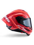 Casque Alpinestars Supertech R10 Arius, casque de course intégral, rouge et orange brillant, vue de profil présentant un spoiler arrière aérodynamique, logo Astars blanc sur la mentonnière et visière transparente, conçu pour la performance sur piste à haute vitesse