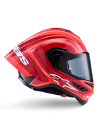 Casque Alpinestars Supertech R10 Arius, casque de course intégral, rouge et orange brillant, vue de profil présentant un spoiler arrière aérodynamique, logo Astars blanc sur la mentonnière et visière transparente, conçu pour la performance sur piste à haute vitesse