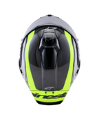 Casque Alpinestars Supertech R10 Arius, vue de dessus, noir, argent et jaune fluo brillant, calotte en fibre de carbone avec rayures jaune fluo éclatantes, orifices de ventilation supérieurs aérodynamiques et logo Alpinestars, casque de course haute performance