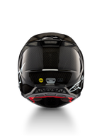 Alpinestars Supertech M10 Solid helm ECE 22.06, zwarte glanzende carbonmotocrosshelm, achteraanzicht met witte graphics, ventilatiepoorten, MIPS en ECE-R 22.06-certificering
