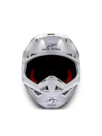 Alpinestars Supertech M10 Helm Solid ECE 22.06, weiß glänzender Motocross-Helm in Frontansicht mit roter und schwarzer Innenpolsterung