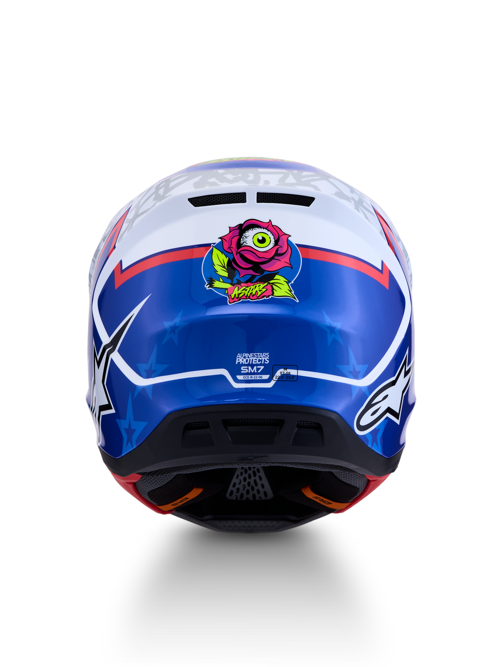 Alpinestars S-M7 Blaster Helm ECE06, blauwe en witte motocrosshelm, achteraanzicht met unieke roos- en oog-grafiek, ECE 22.06 gecertificeerd, aerodynamisch ontwerp voor off-road racing en motorcross.