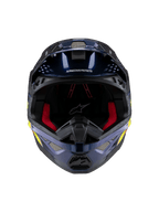 Casque Alpinestars Supertech M10 TLD Edition 25, casque de motocross, bleu foncé métallisé brillant avec rembourrage intérieur rouge, vue de face montrant les grilles de ventilation et les graphismes latéraux jaunes et oranges, protection haut de gamme pour la course tout-terrain.