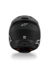 Alpinestars S-M3 Solid Helm ECE 22.06, motorcrosshelm, mat zwart, achteraanzicht met witte Alpinestars Astar-logo's, ventilatie-uitlaatopeningen aan de basis, strakke matte afwerking voor off-road rijden