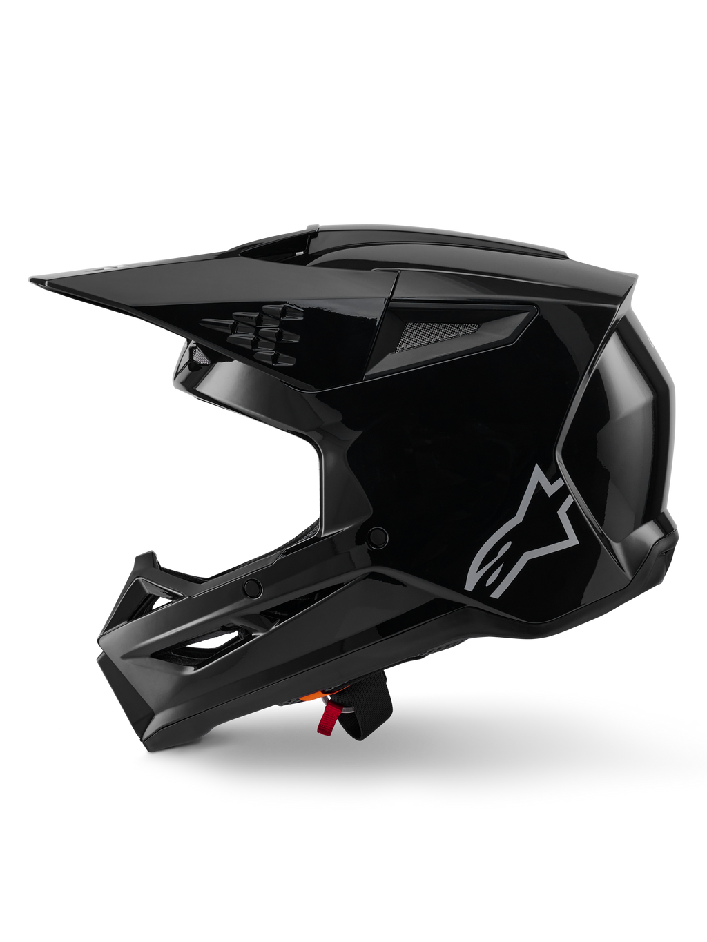 Alpinestars S-M3 Solid helm, motorcrosshelm, zwart glanzend, zijaanzicht, met een zilveren Alpinestars-logo, aerodynamisch vizier en meerdere ventilatieopeningen voor off-road racing