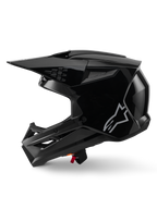 Alpinestars S-M3 Solid helm, motorcrosshelm, zwart glanzend, zijaanzicht, met een zilveren Alpinestars-logo, aerodynamisch vizier en meerdere ventilatieopeningen voor off-road racing
