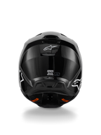 Alpinestars S-M3 Solid helm, motorcrosshelm, glanzend zwarte afwerking, achteraanzicht met wit Alpinestars-logo, ECE 22.06-certificeringslabel en aerodynamische schaal met uitlaatpoorten