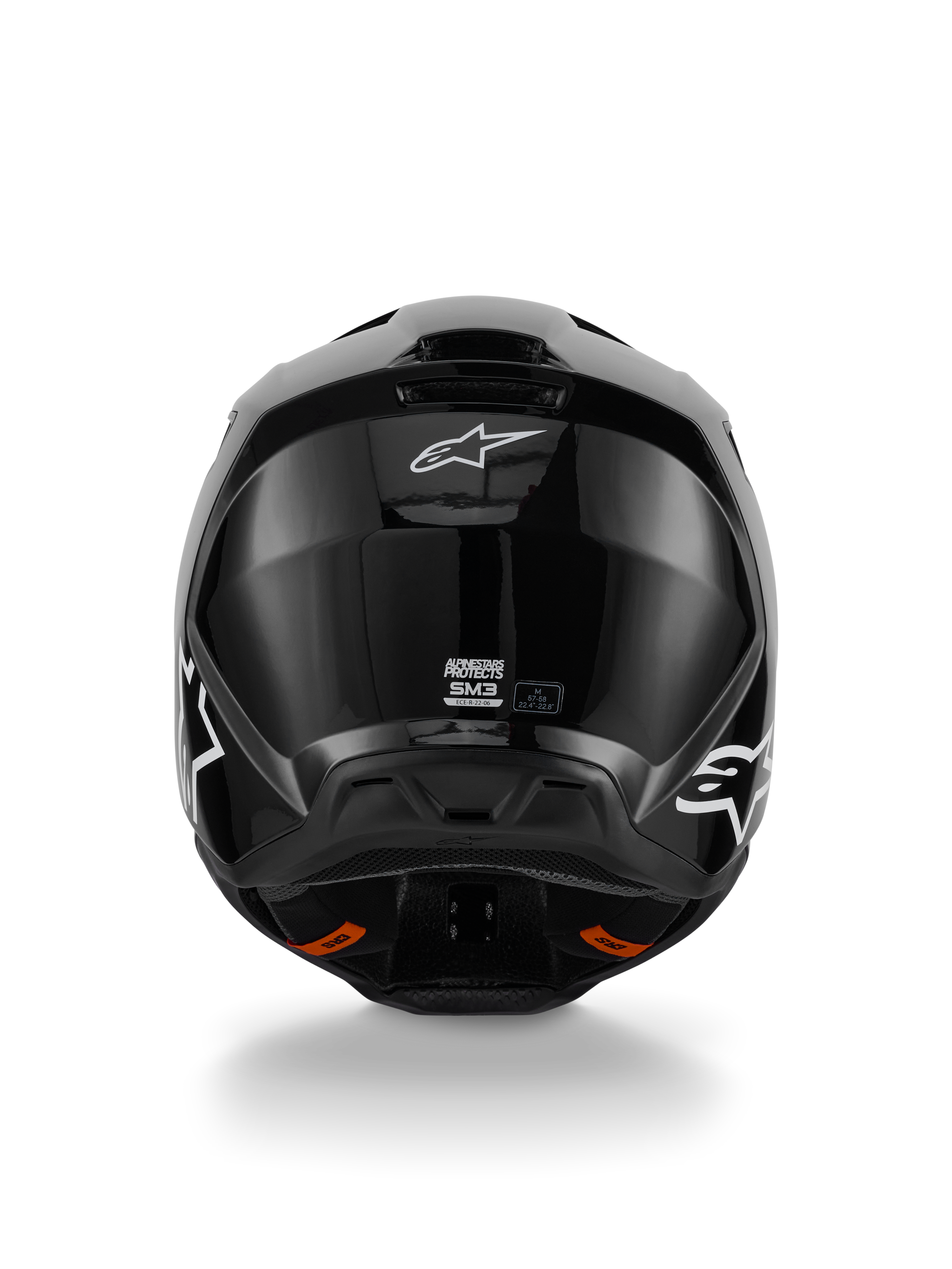 Alpinestars S-M3 Solid helm, motorcrosshelm, glanzend zwarte afwerking, achteraanzicht met wit Alpinestars-logo, ECE 22.06-certificeringslabel en aerodynamische schaal met uitlaatpoorten
