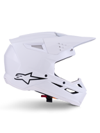 Alpinestars S-M3 Solid helm, motorcrosshelm, glanzend wit, zijaanzicht met zwart sterlogo, hoekige aerodynamische schaal, meerdere ventilatieopeningen, geïntegreerd vizier en kinbeschermer, off-road racebescherming