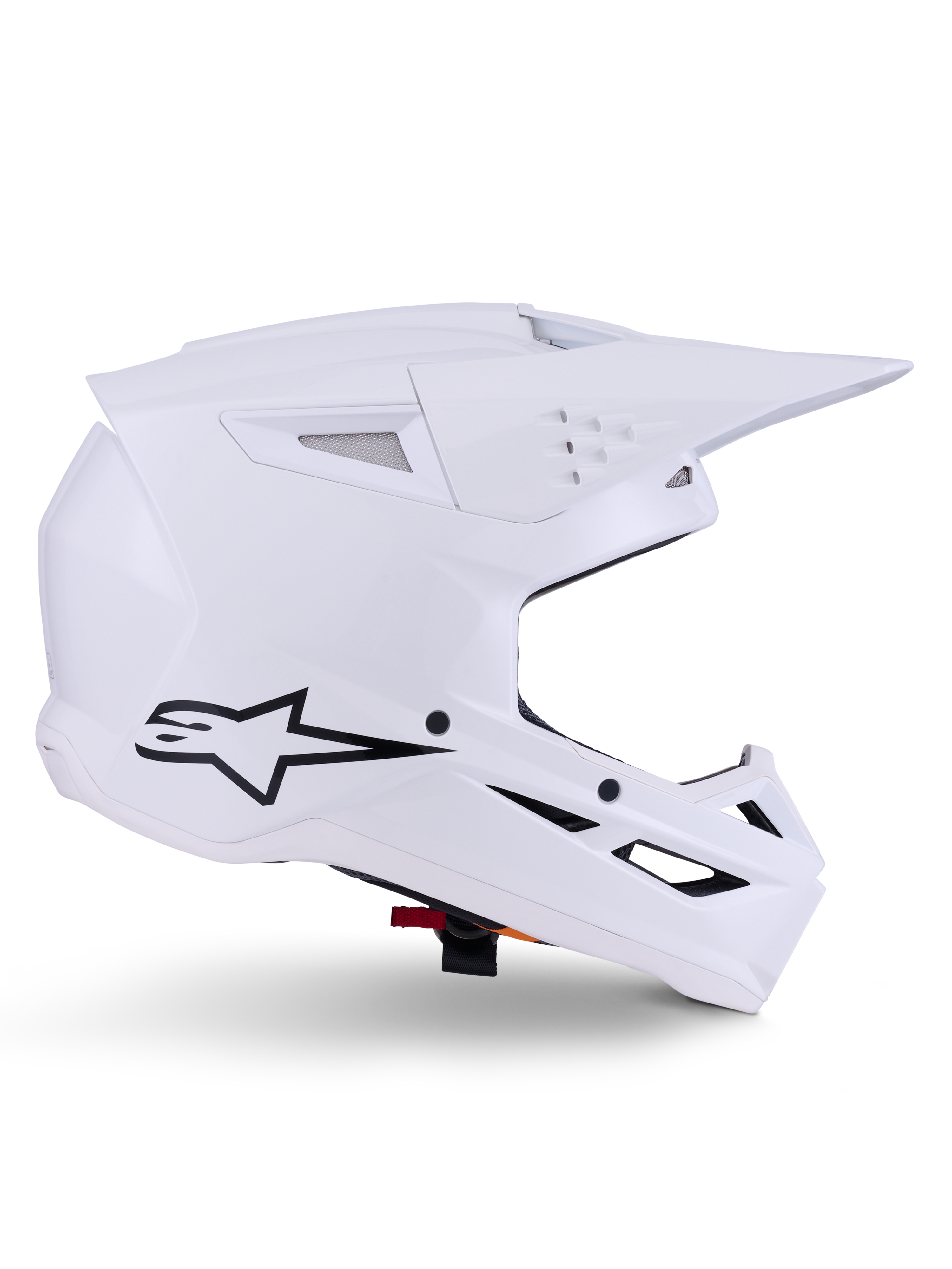 Alpinestars S-M3 Solid helm, motorcrosshelm, glanzend wit, zijaanzicht met zwart sterlogo, hoekige aerodynamische schaal, meerdere ventilatieopeningen, geïntegreerd vizier en kinbeschermer, off-road racebescherming