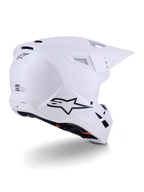 Alpinestars S-M3 Solid Helm, motorcrosshelm, glanzend wit, driekwart achteraanzicht met zwart Alpinestars-logo, ventilatieopeningen en aerodynamisch schaalontwerp voor off-road racing.