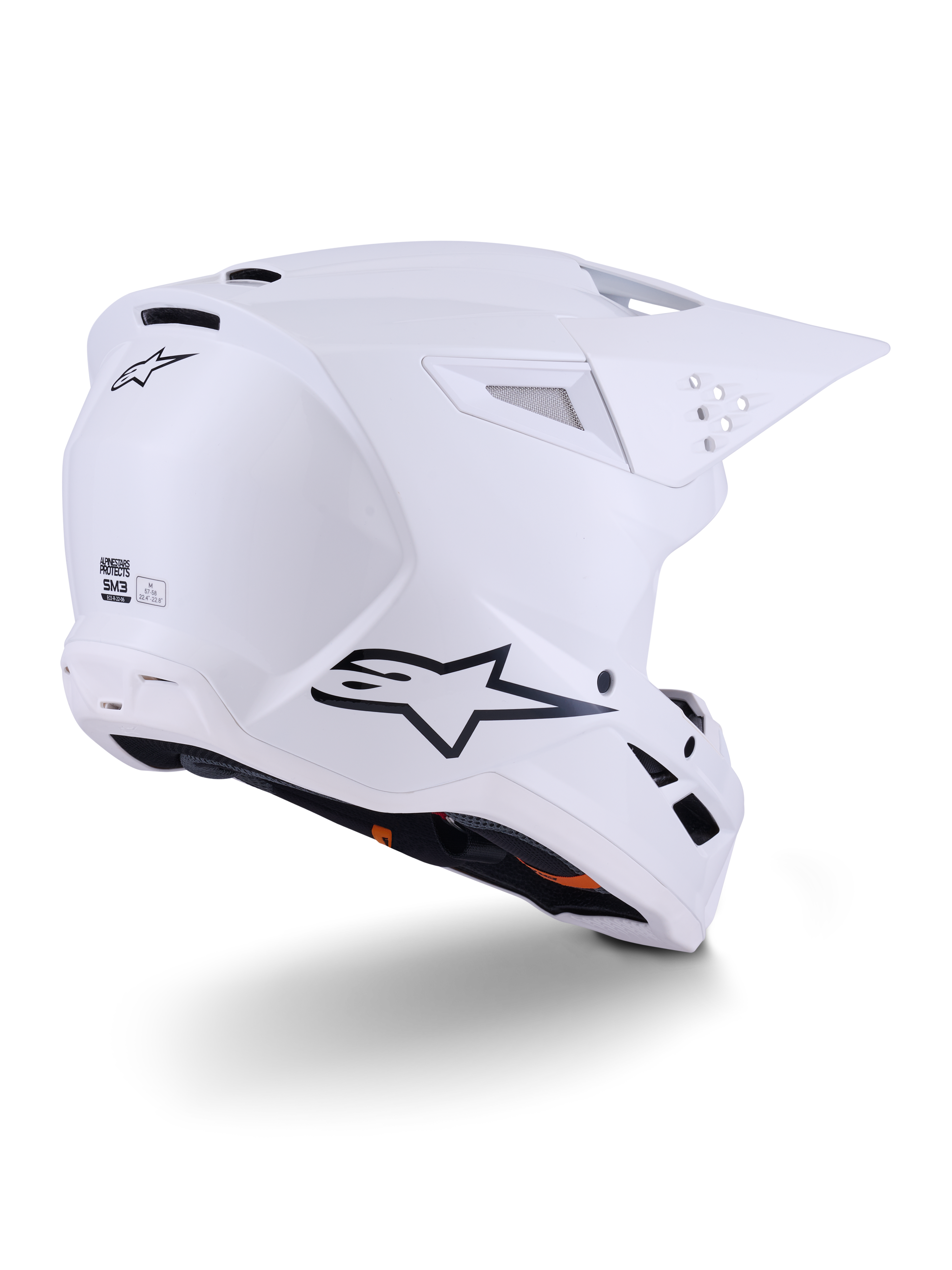 Alpinestars S-M3 Solid Helm, motorcrosshelm, glanzend wit, driekwart achteraanzicht met zwart Alpinestars-logo, ventilatieopeningen en aerodynamisch schaalontwerp voor off-road racing.