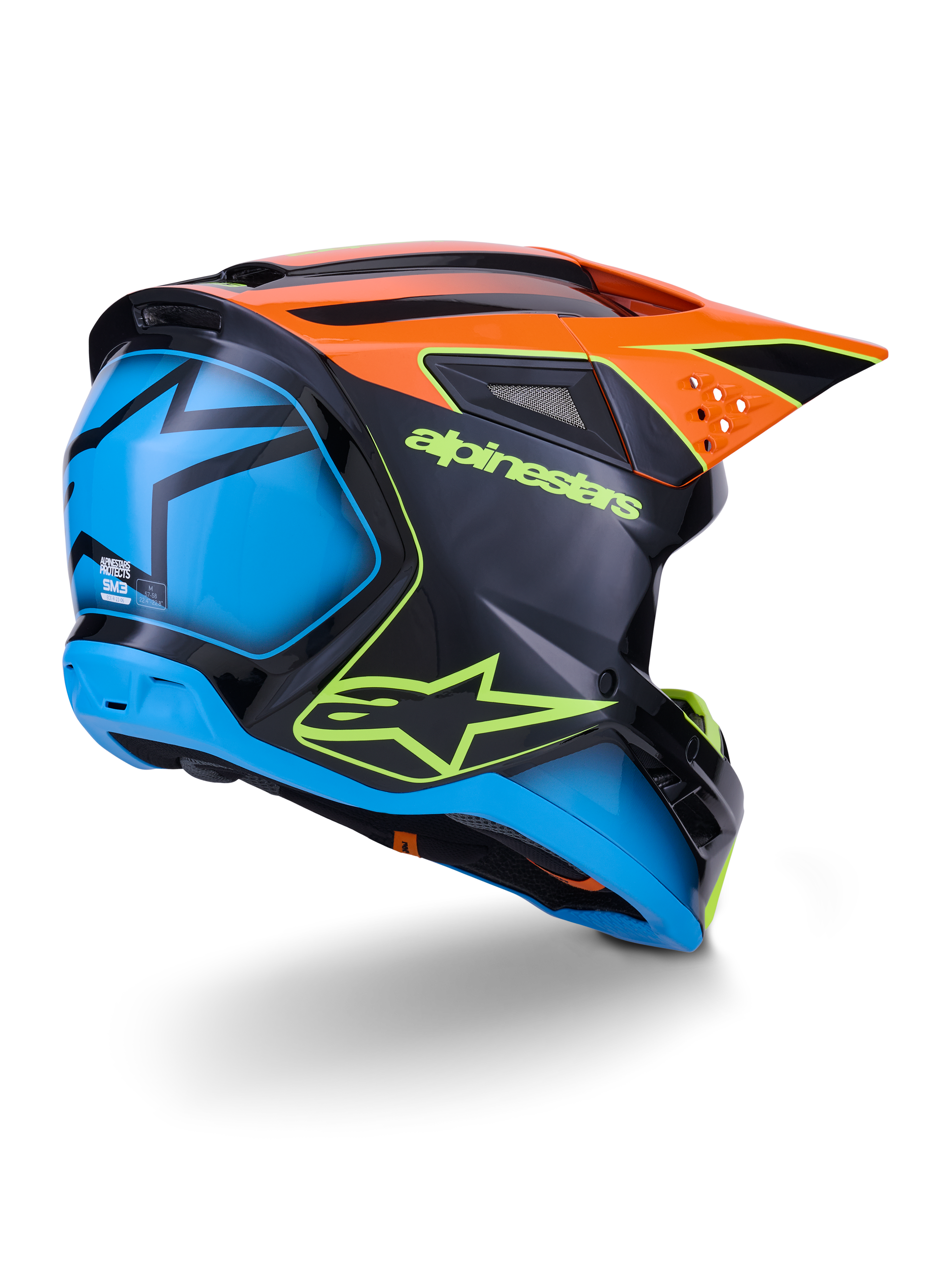 Alpinestars S-M3 Fray Helm ECE 22.06, motorcrosshelm, zwart met oranje en blauwe panelen, voorzien van neongeel Alpinestars-logo, groot blauw achtergedeelte met ster-graphic, oranje vizier met geïntegreerde ventilatieopeningen, professionele off-road beschermingsuitrusting