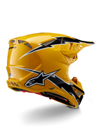 Alpinestars Supertech M10 Ampress Helmet, Motocross Helmet, Black Yellow Glossy, featuring a high-gloss yellow finish with black and white lightning-style graphics, rear three-quarter view showing aerodynamic shell and integrated ventilation ports.
