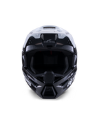 Alpinestars S-M3 Radium Helmet, Motocross Helmet, Black White and Gray Glossy, front-facing view, featuring an aggressive shell design with a white visor, black chin guard, and mesh-lined ventilation ports.