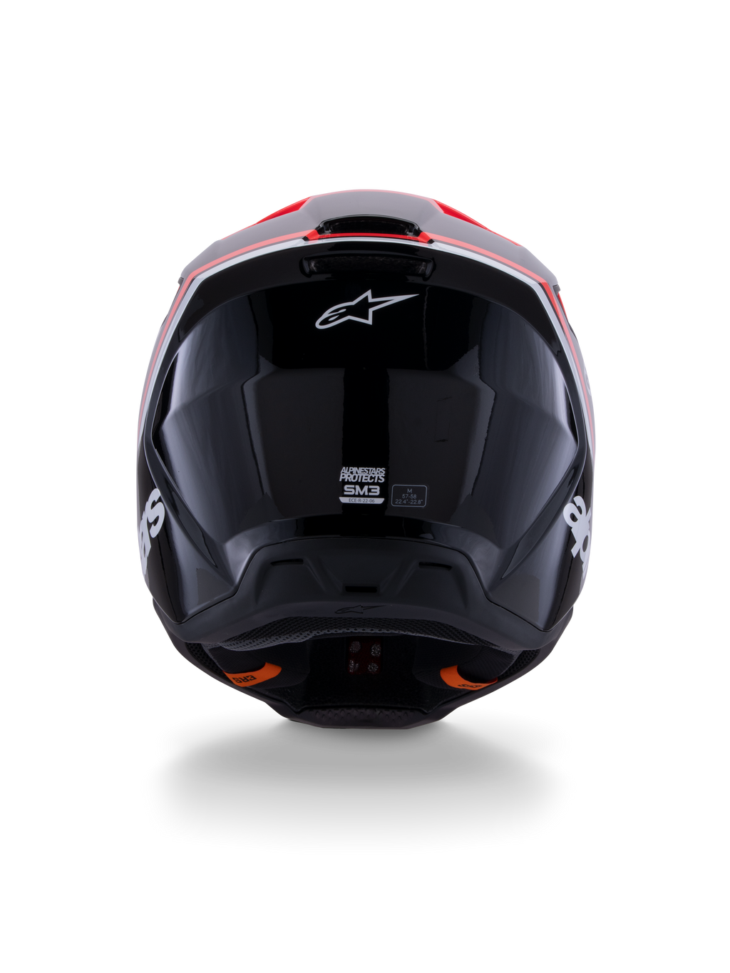 Casque Alpinestars S-M3 Radium ECE 22.06, casque de motocross, noir brillant avec des accents rouge fluo et blanc, vue arrière montrant la conception aérodynamique de la coque, le logo étoile blanc et les étiquettes de certification.
