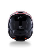 Casque Alpinestars S-M3 Radium ECE 22.06, casque de motocross, noir brillant avec des accents rouge fluo et blanc, vue arrière montrant la conception aérodynamique de la coque, le logo étoile blanc et les étiquettes de certification.