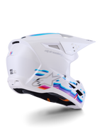 Alpinestars S-M3 Force OCD Helm, Motocross-Helm, Weiß glänzend mit leuchtend blauen und lila fließenden Grafiken, silbernem Astar-Logo und seitlichen Belüftungsöffnungen, aerodynamisches Schalendesign für den Offroad-Rennsport