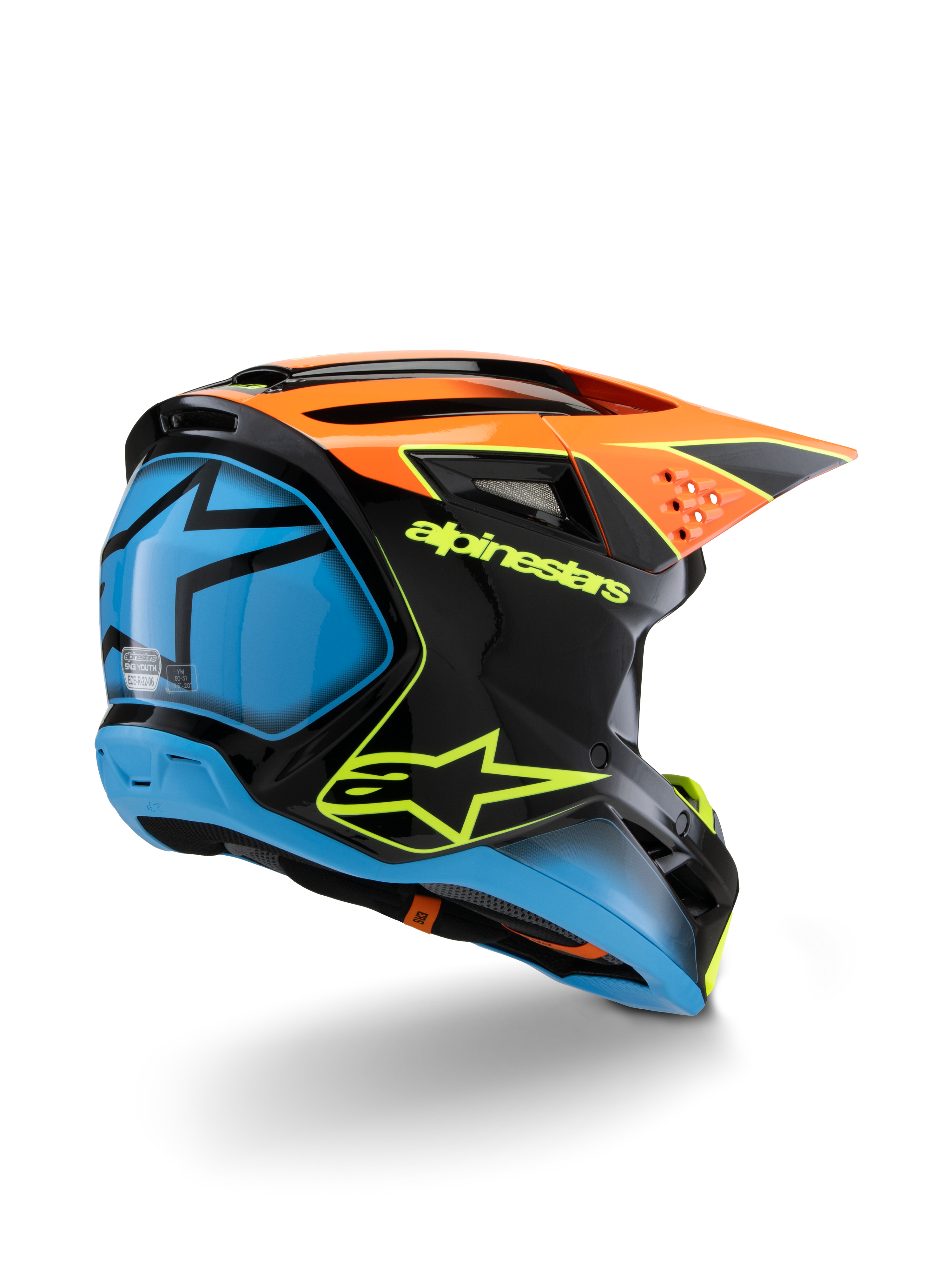 Alpinestars S-M3 Youth Fray helm, motorcrosshelm, zwart, oranje en blauw met neongele accenten, driekwart achteraanzicht toont opvallende Alpinestars-branding en sterlogo, strak aerodynamisch ontwerp voor off-road racen voor de jeugd