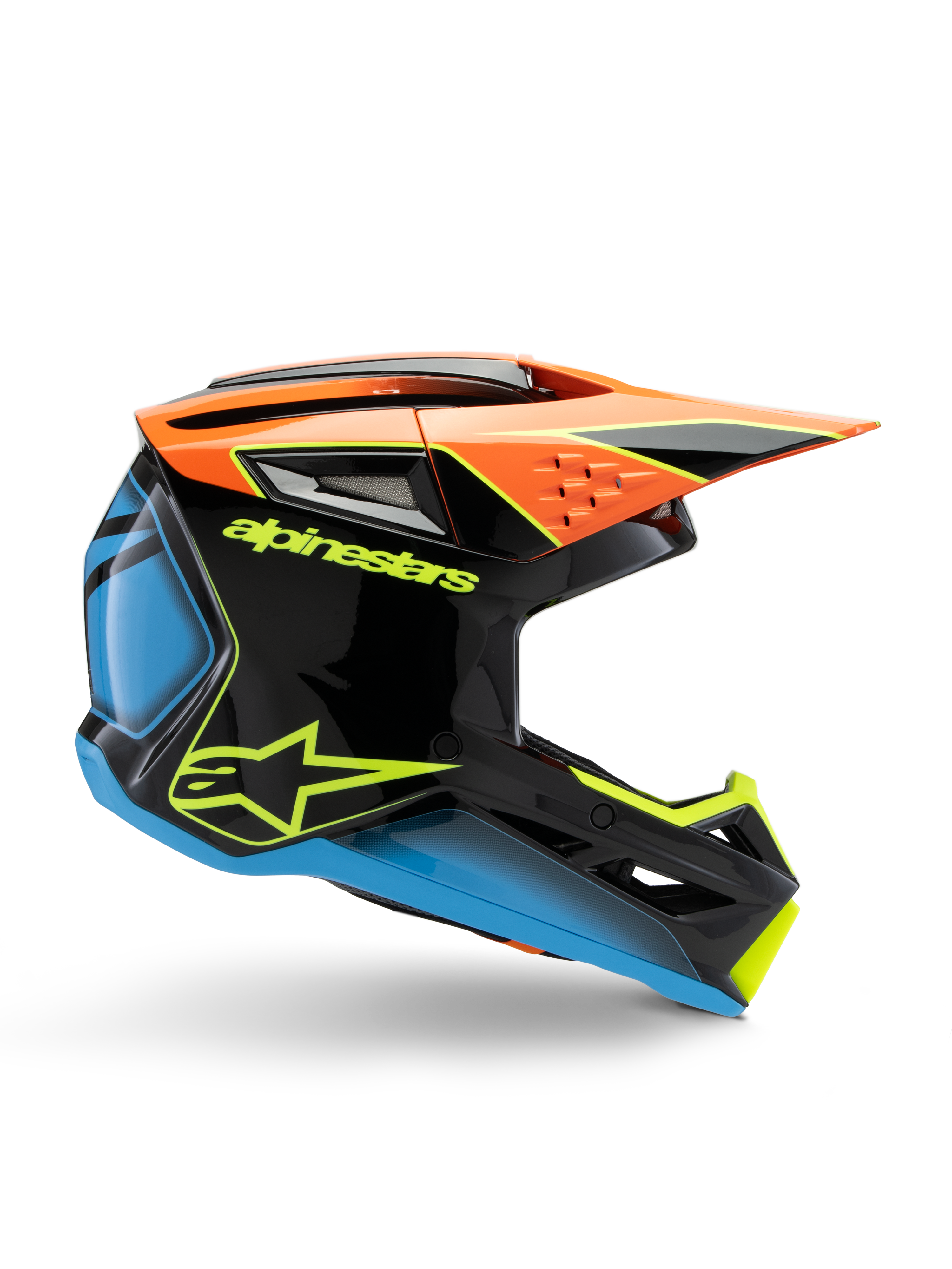 Casque de motocross Alpinestars S-M3 Youth Fray, noir avec des accents orange, bleu et jaune fluorescent, vue de profil montrant le design aérodynamique, les aérations et la visière profilée, finition brillante avec logo jaune vif.