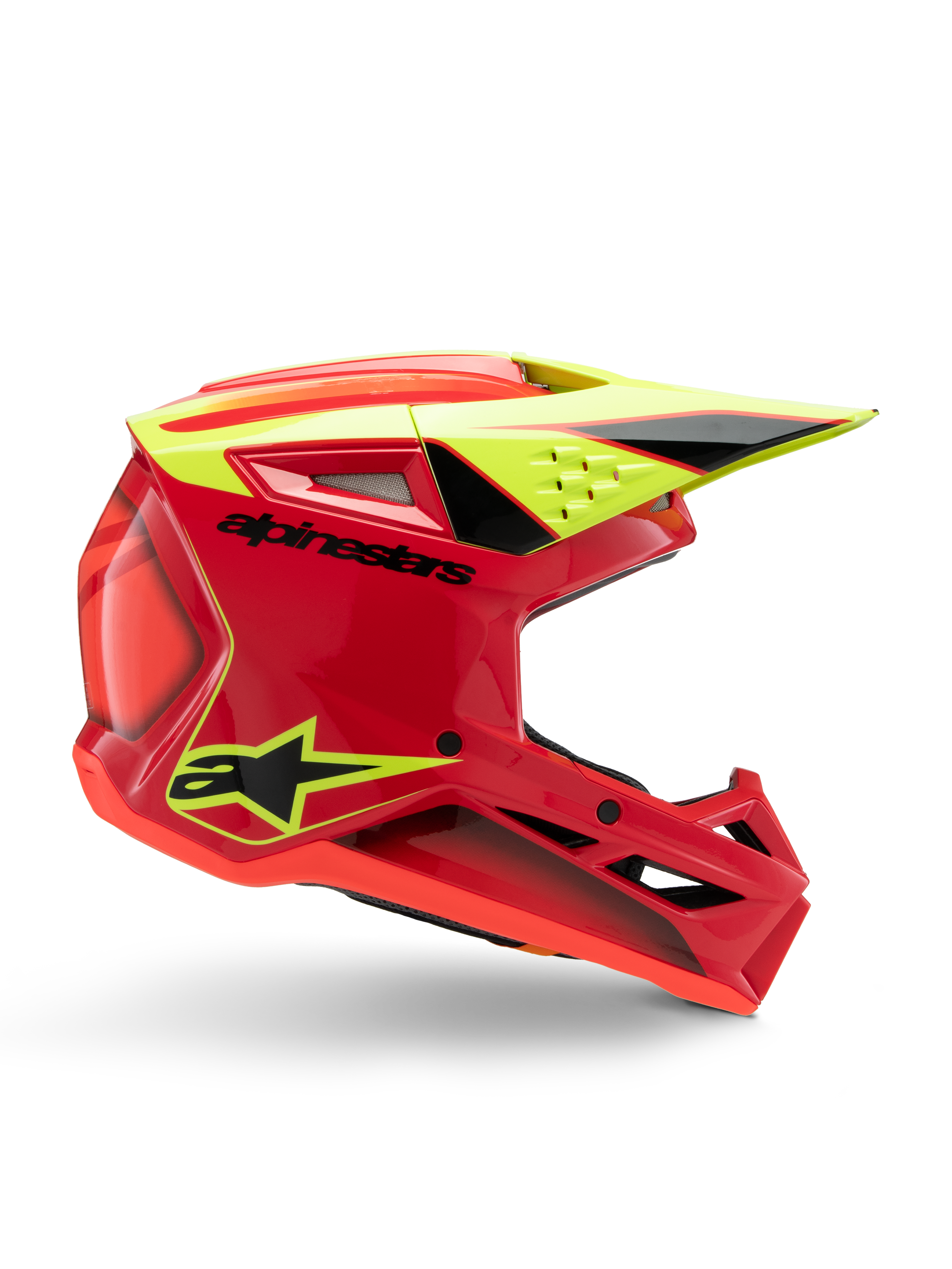 Casque Alpinestars S-M3 Youth Fray, casque de motocross, rouge, jaune fluo et noir brillant, vue de profil montrant un design aérodynamique élégant avec visière intégrée et aérations proéminentes, logo noir audacieux sur une coque rouge vif, optimisé pour les performances tout-terrain des jeunes pilotes